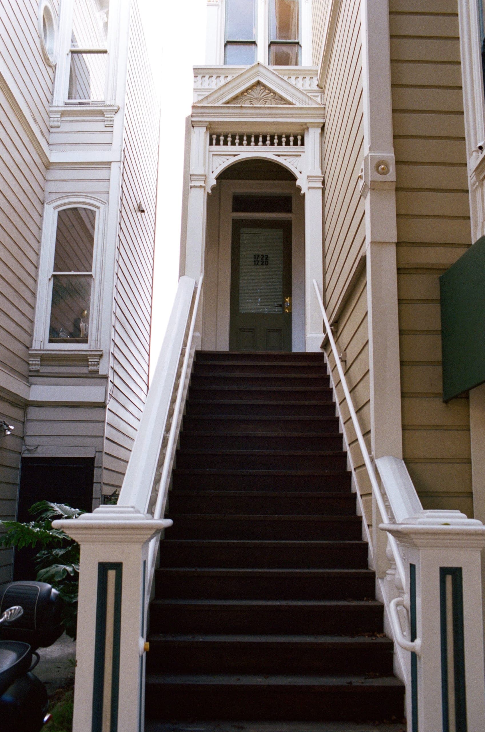 Stairs leading up to a Victorian doorway, addresses 1720 and 1722